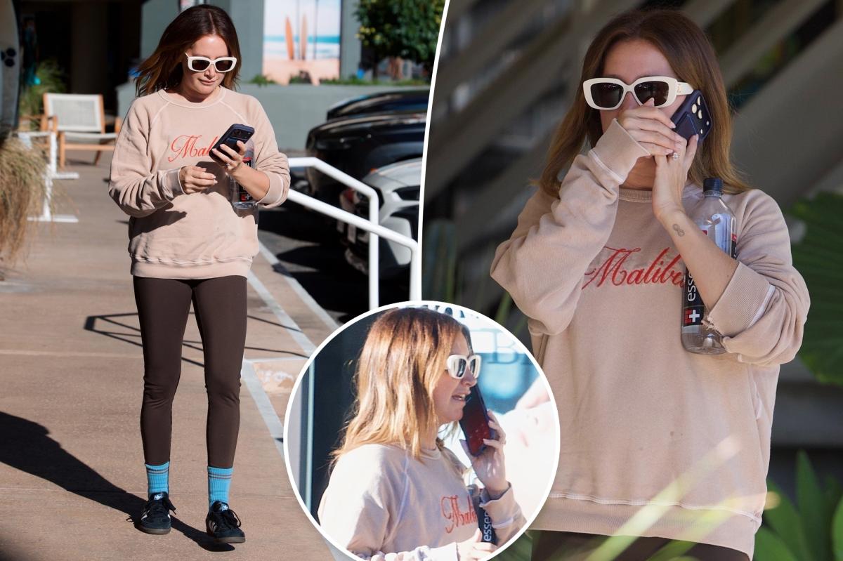 See photos of Ashley Tisdale’s  somber phone conversation as ‘toxic’ mom group drama continues