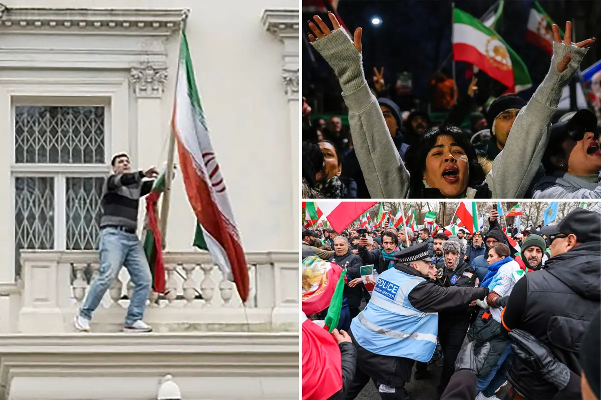 Protester scales Iranian Embassy in London, tears down regime flag, hoists pre-revolution symbol