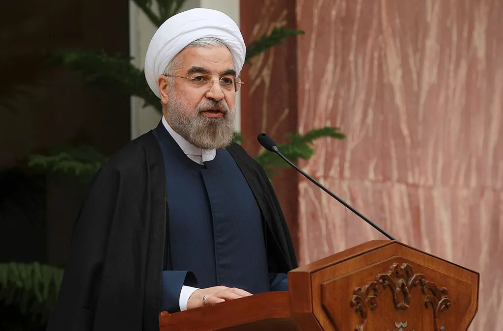 Hassan Rouhani speaking at a news briefing in Tehran after agreeing to a deal over Iran's nuclear program.