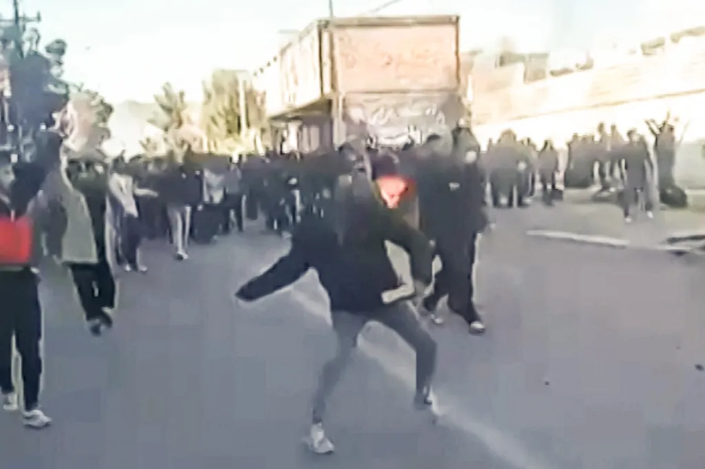 Protestors attacking a government building in Fasa, Iran.
