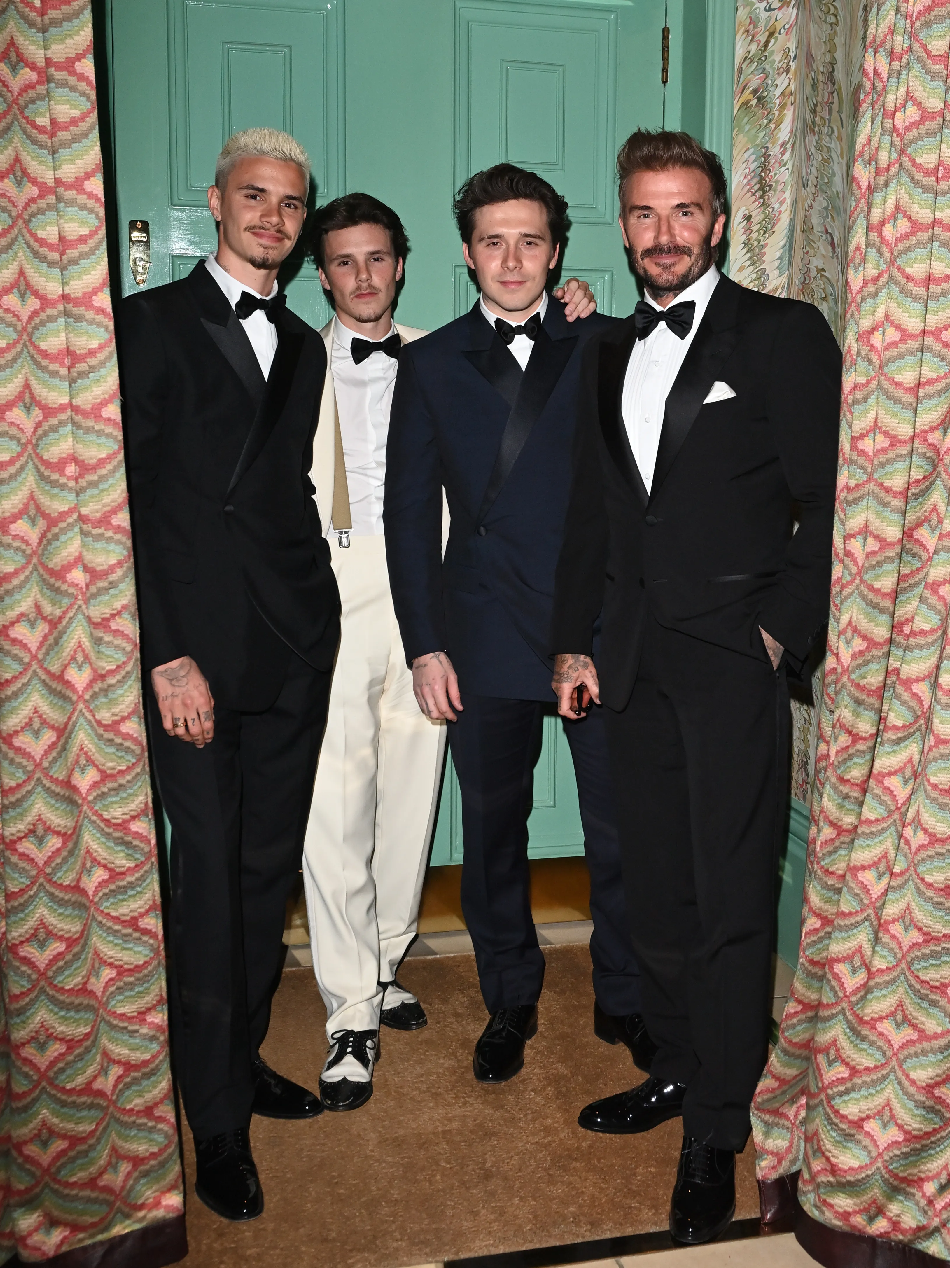 David Beckham, Brooklyn Beckham, Romeo Beckham, and Cruz Beckham posing at Victoria Beckham's 50th Birthday Party.