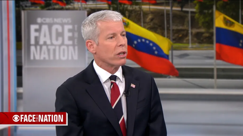 Energy Secretary Chris Wright appears on CBS’s “Face the Nation” with Venezuelan flags in the background.