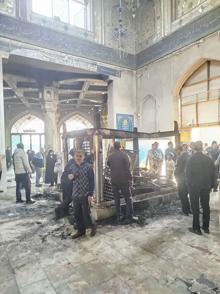 People inspect a shrine set on fire by protesters in Dezful, Iran on Jan. 9, 2026.