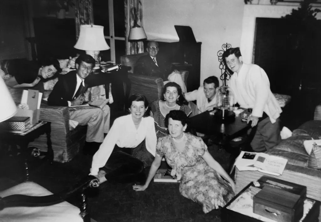 John Kennedy Jr., Jackie Onassis, Caroline Kennedy, Rose Kennedy, and Ted Kennedy pose for a photo at Caroline Kennedy's graduation party.