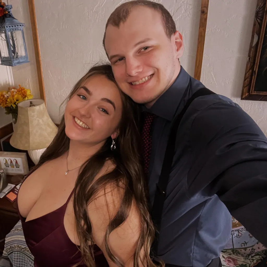 Kaitlyn Ostolaza and her fiancé Cameron Niesman smiling.