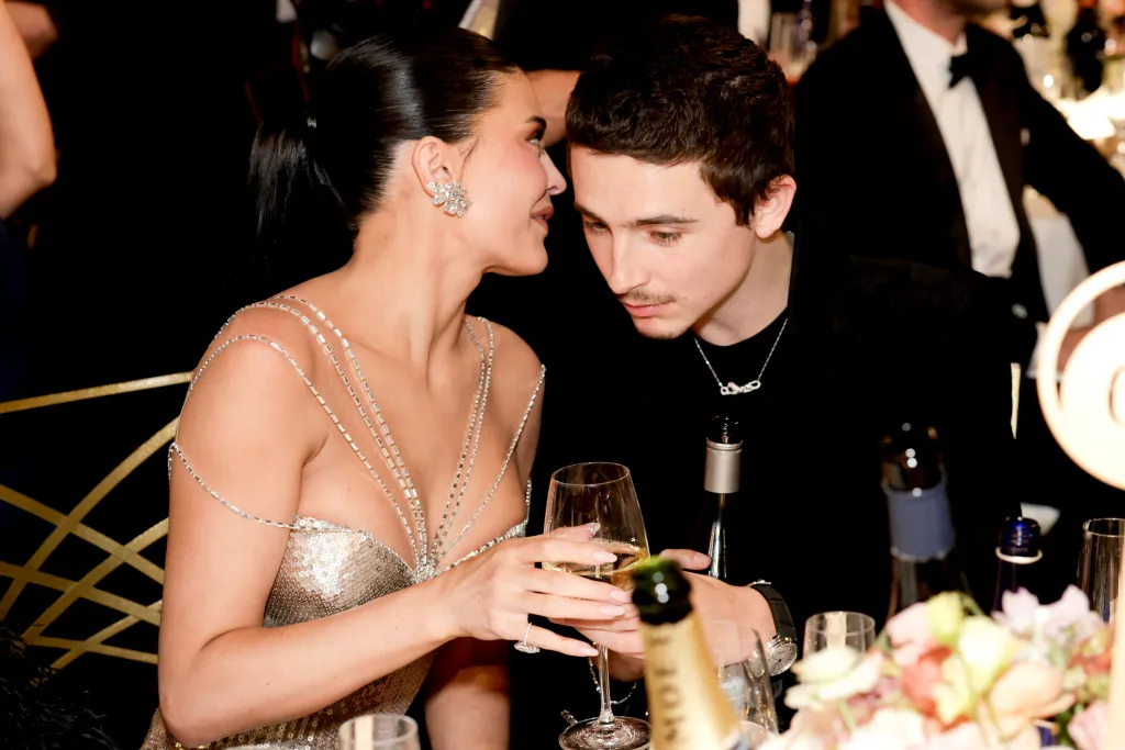 Kylie Jenner whispering to Timothée Chalamet at the 83rd Annual Golden Globe Awards.