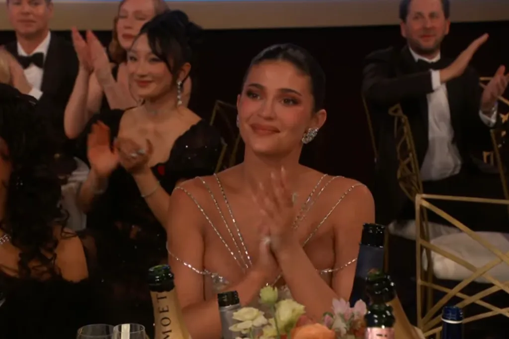 Kylie Jenner applauding at the Golden Globes.