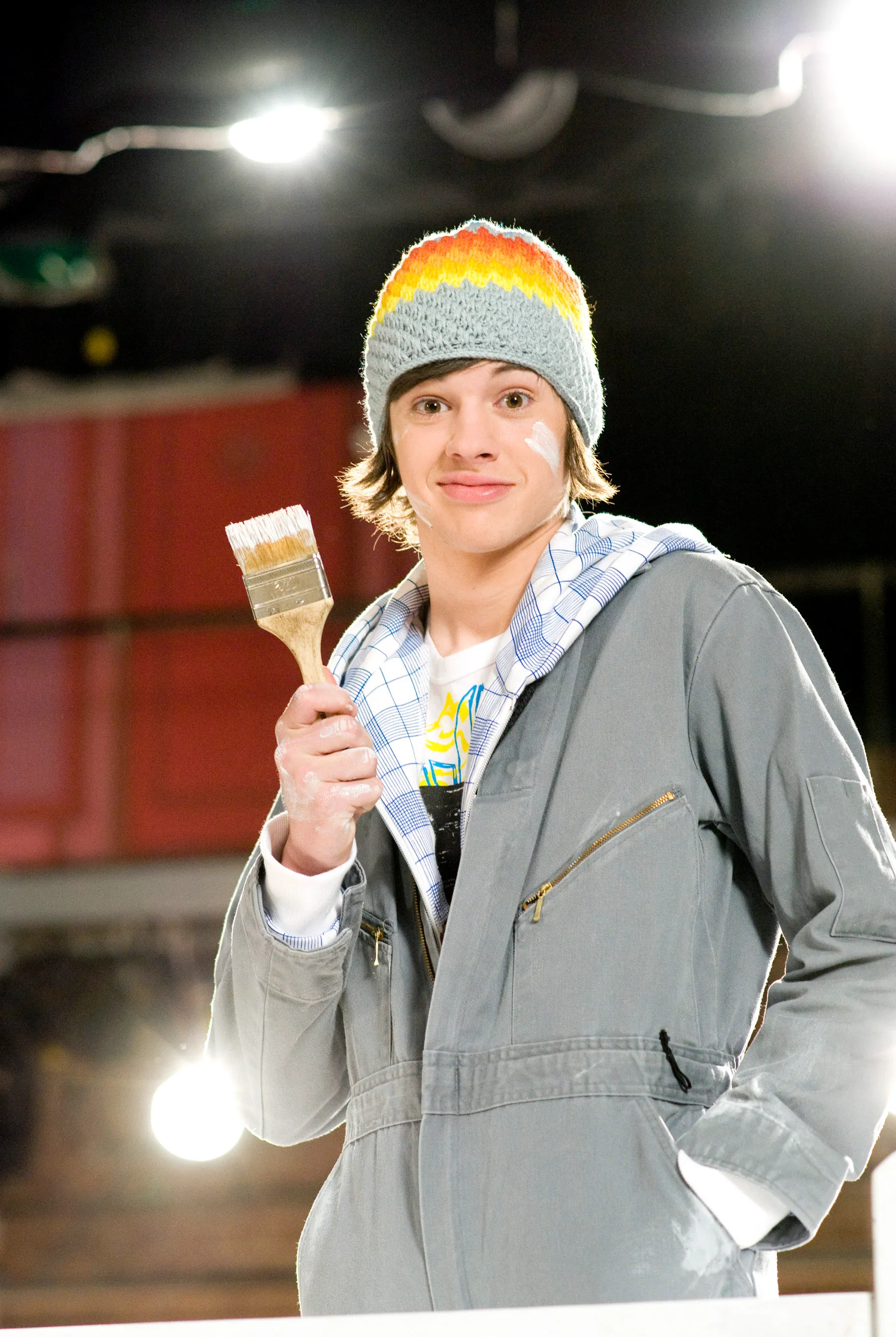 Matt Prokop as Jimmie Zara in High School Musical 3: Senior Year, wearing a beanie and overalls, holding a paint brush.