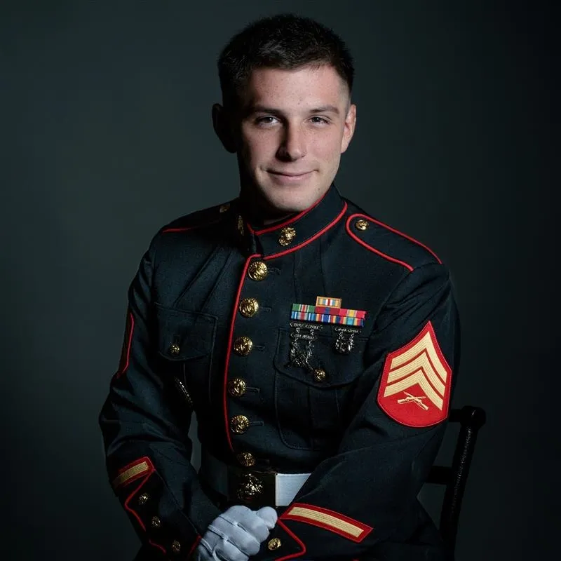Trevor Reed in a Marine Corps uniform with medals and stripes.