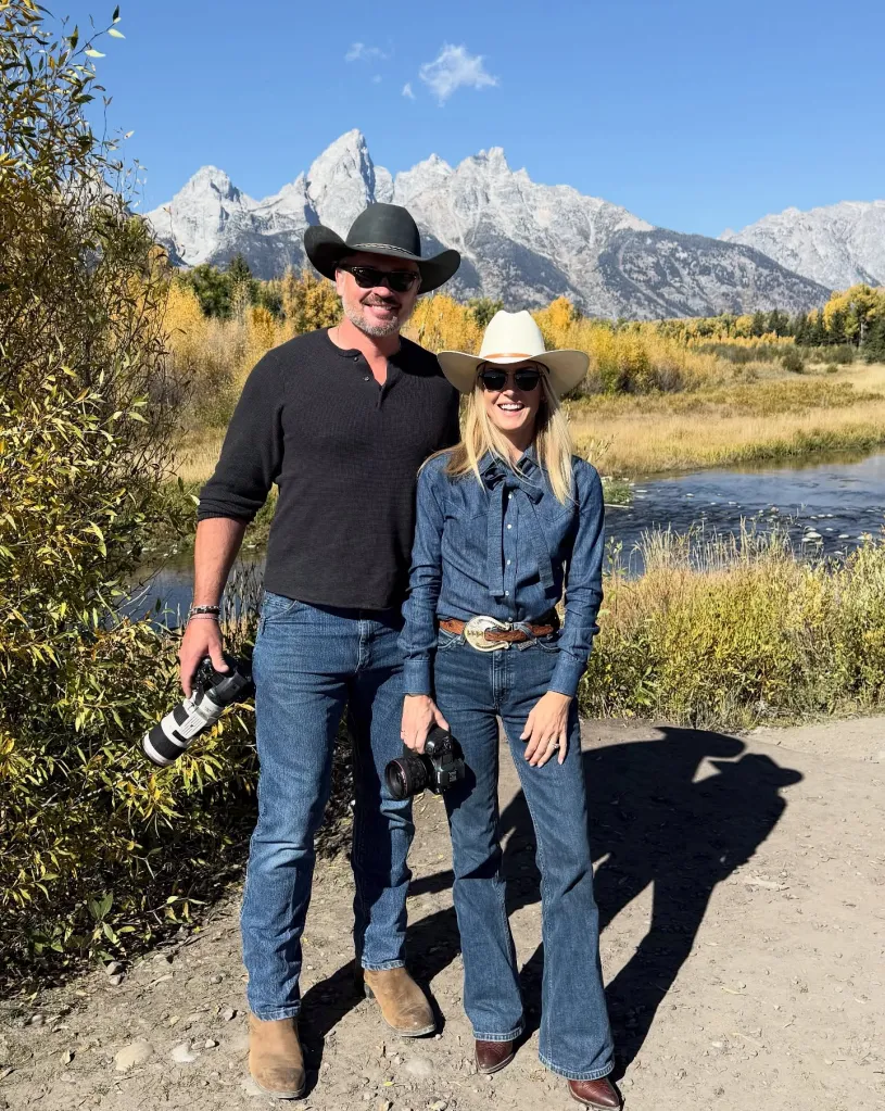 Tom Welling and his family posing in front of a mountainous landscape.