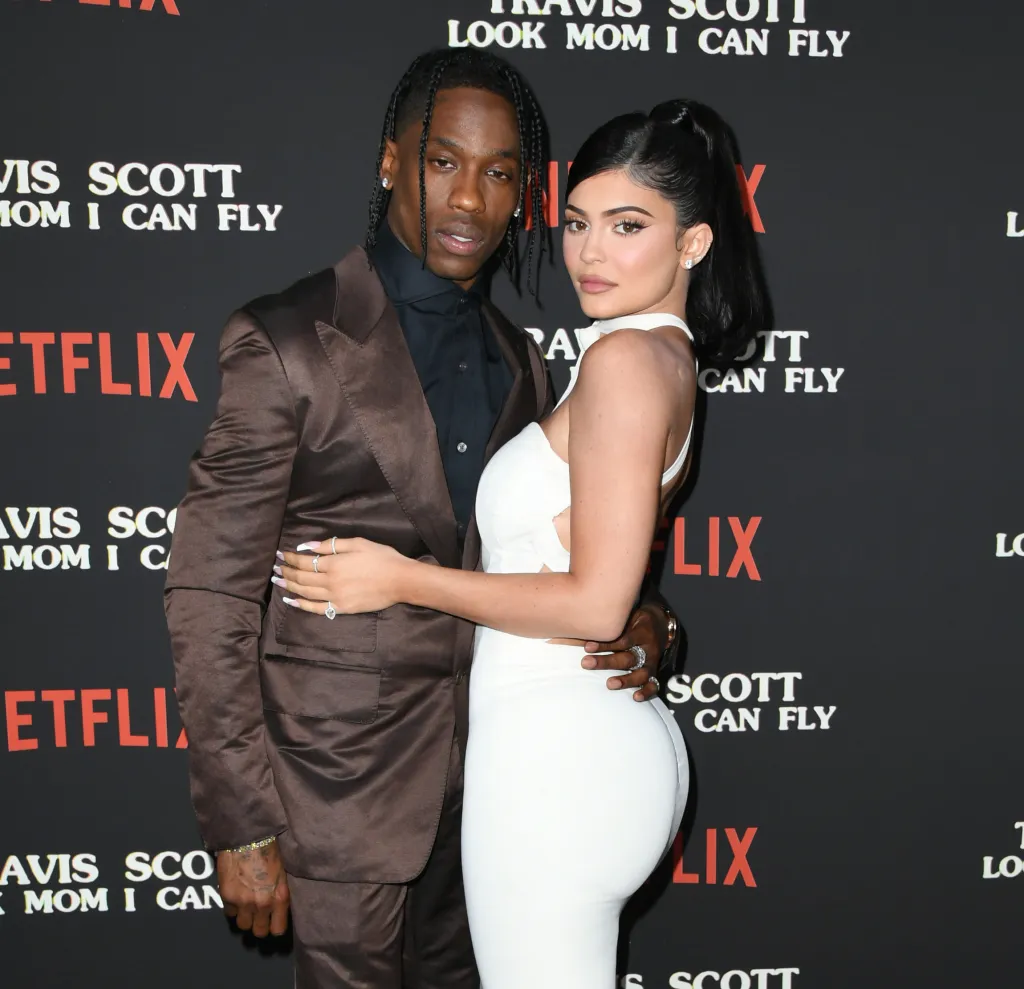 Travis Scott and Kylie Jenner posing at the premiere of "Travis Scott: Look Mom I Can Fly."
