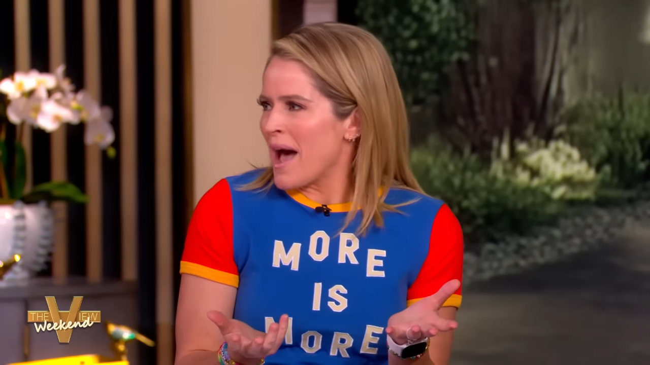 Sara Haines wearing a blue shirt that says "More is More" on The View Weekend.