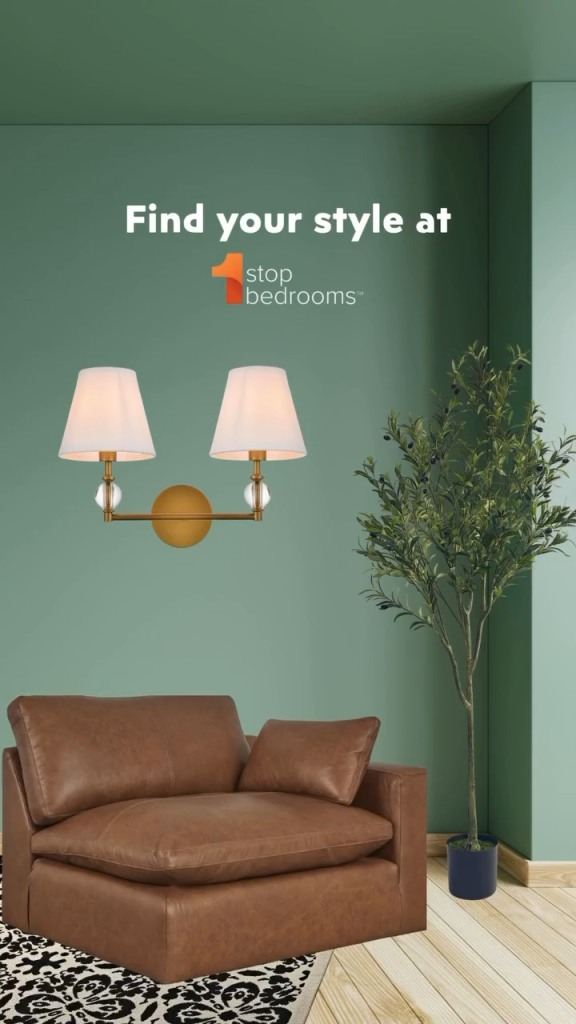 Brown leather armchair with white wall sconce and olive tree, text "Find your style at 1 Stop Bedrooms".