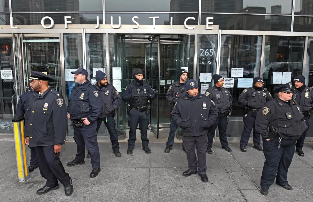 NYPD officers gathered outside the Bronx Criminal Courthouse after Sergeant Erik Duran's arraignment.
