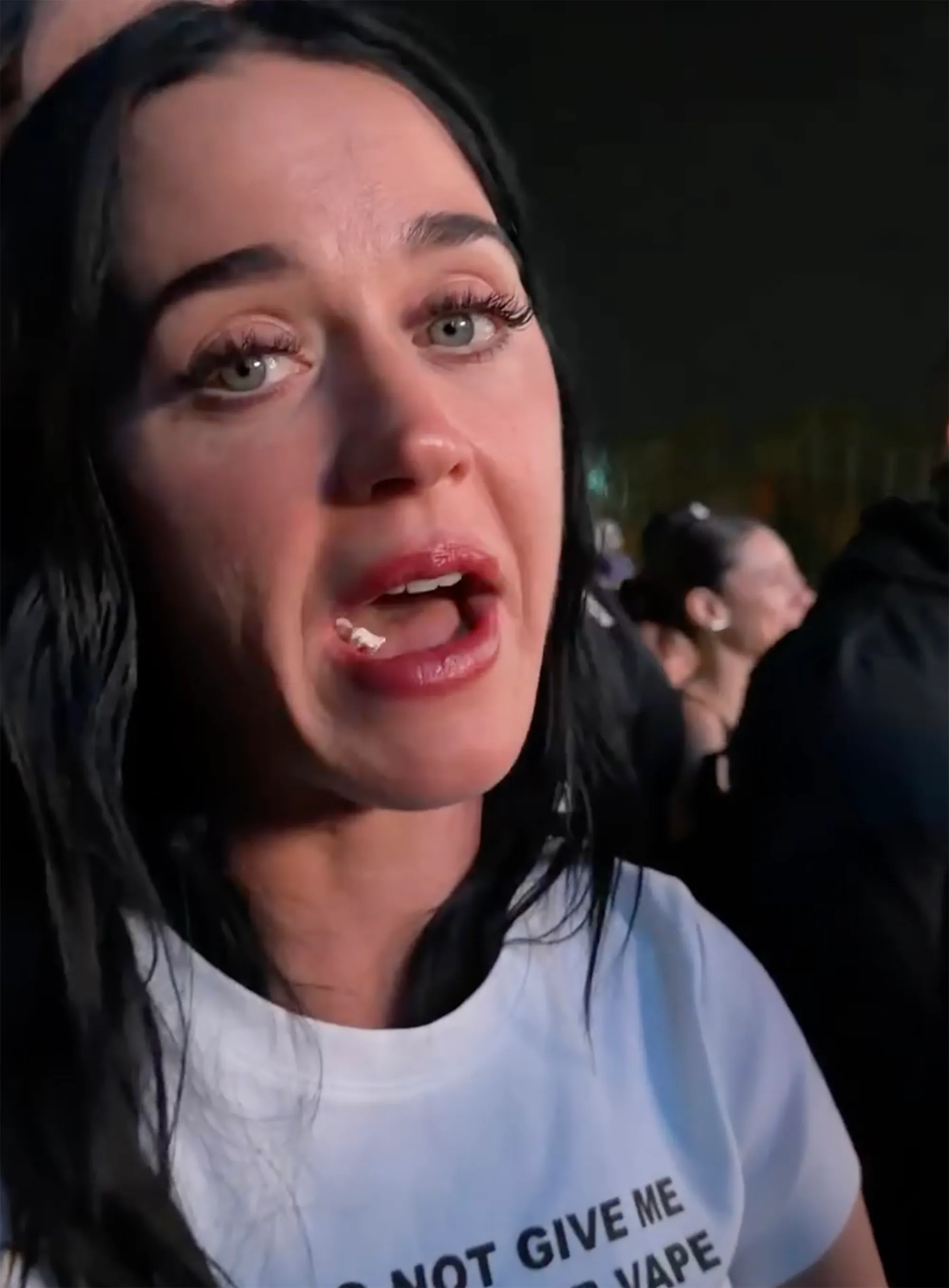 Katy Perry with popcorn in her mouth.