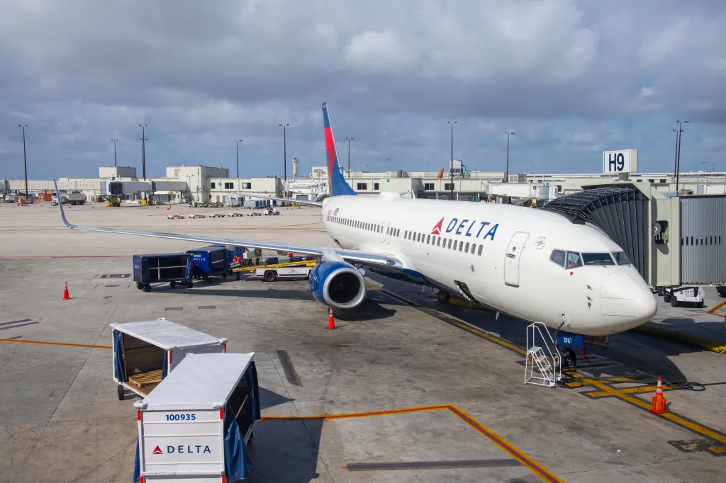 A Delta Air Lines flight passenger was removed from a plane in Miami after refusing to end a phone call before takeoff, causing a delay and enraging other travelers.