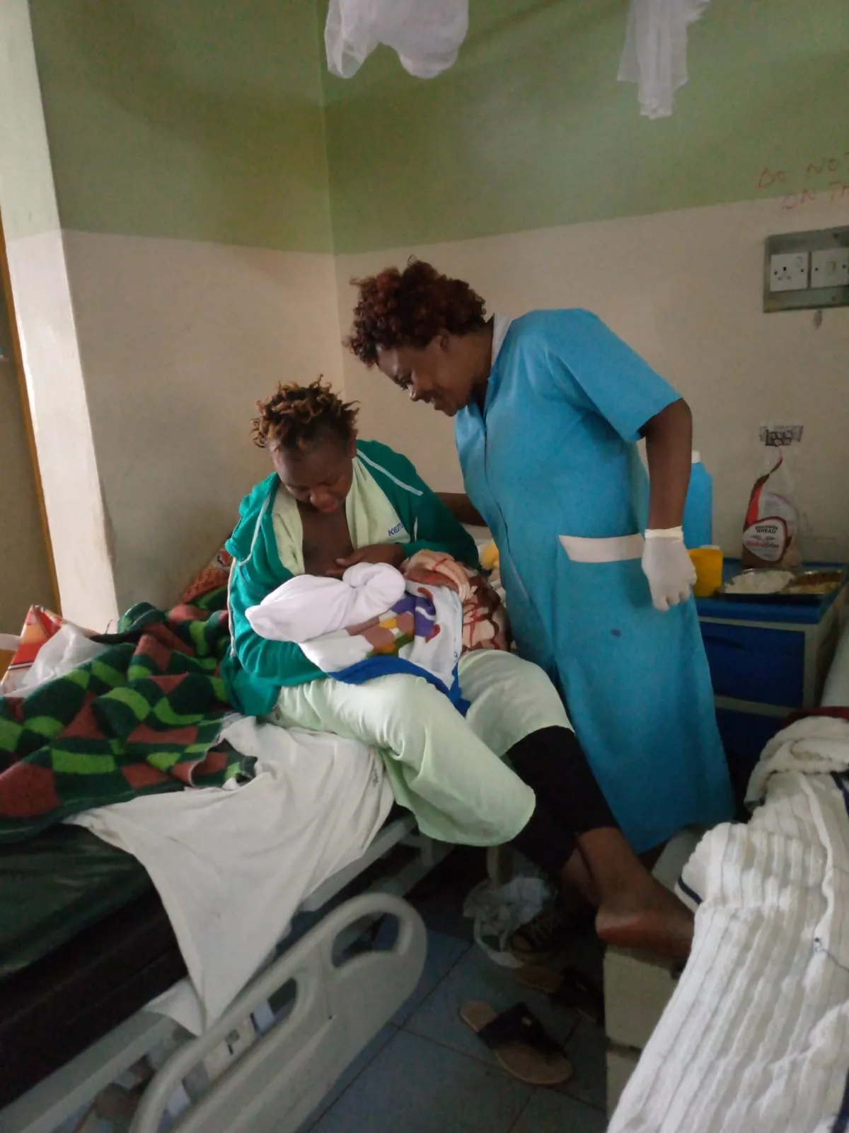 Margaret Odera, a community health worker in Kenya, checks on a mother who just gave birth.