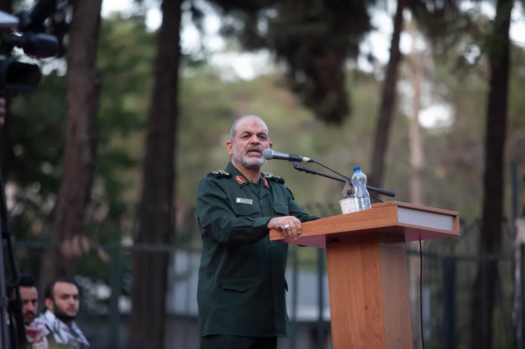 Ahmad Vahidi, former IRGC Quds Force commander, speaks at a podium.