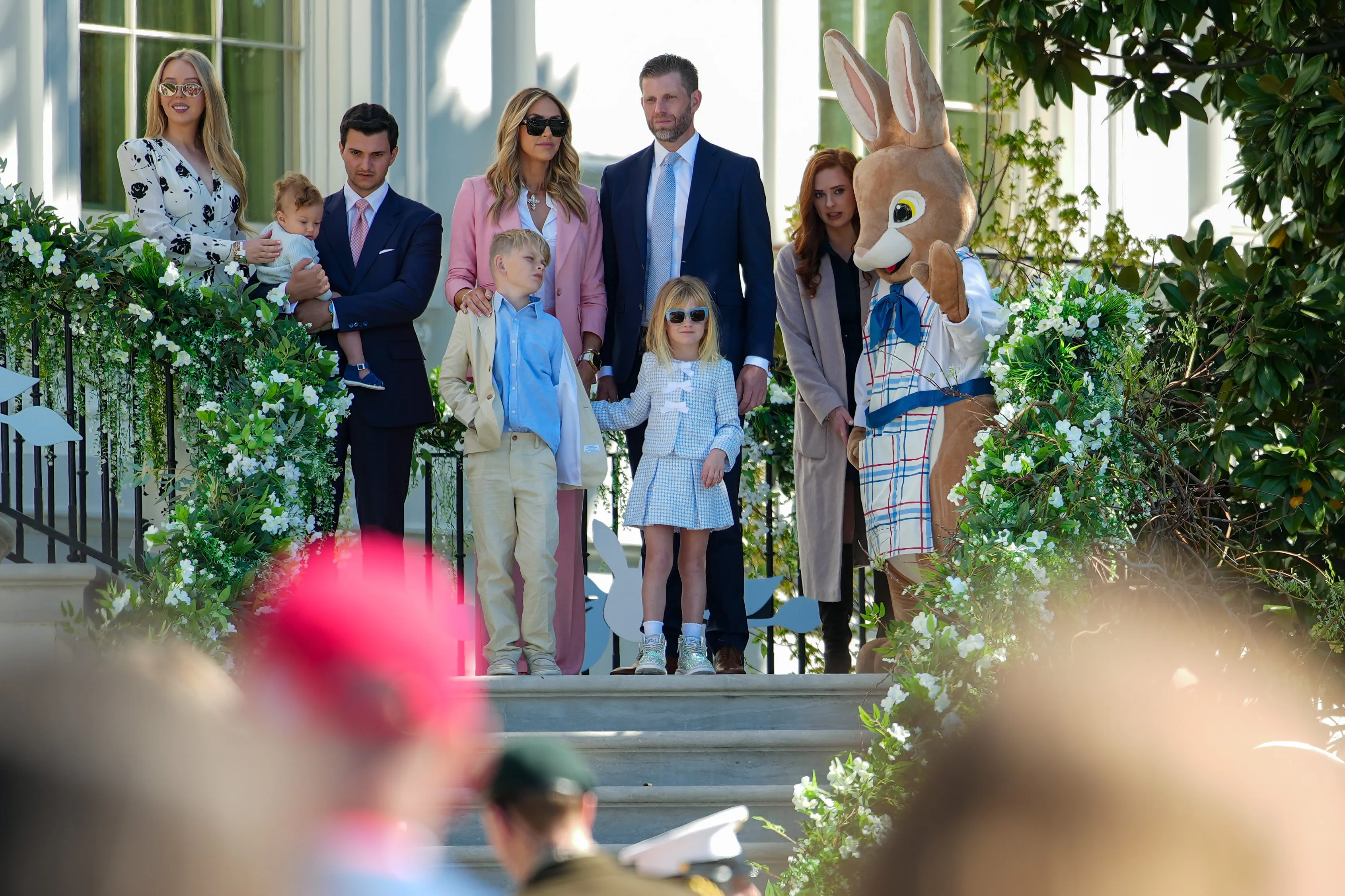 Tiffany Trump, Michael Boulos, Lara Trump, Eric Trump, and their children attend the White House Easter Egg Roll with a person in an Easter Bunny costume.