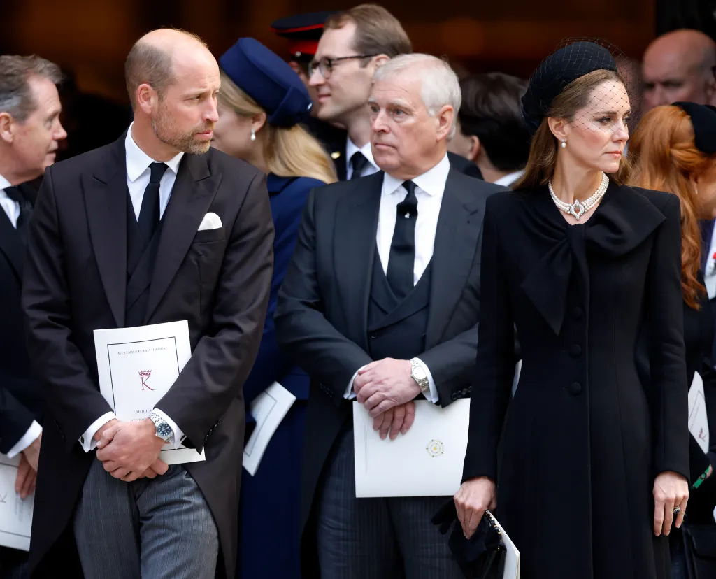 Prince William, Prince Andrew, and Catherine, Princess of Wales, in black attire at a funeral service.