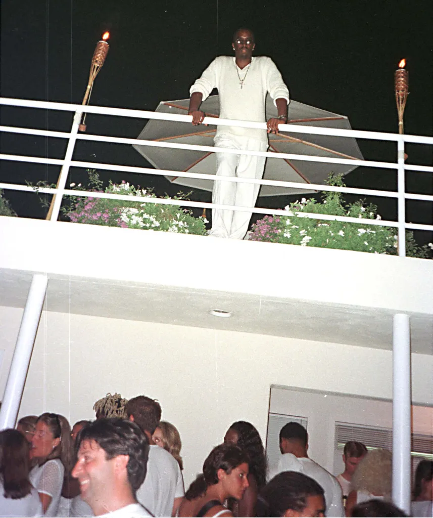P. Diddy watching his Labor Day party from a balcony in East Hampton.