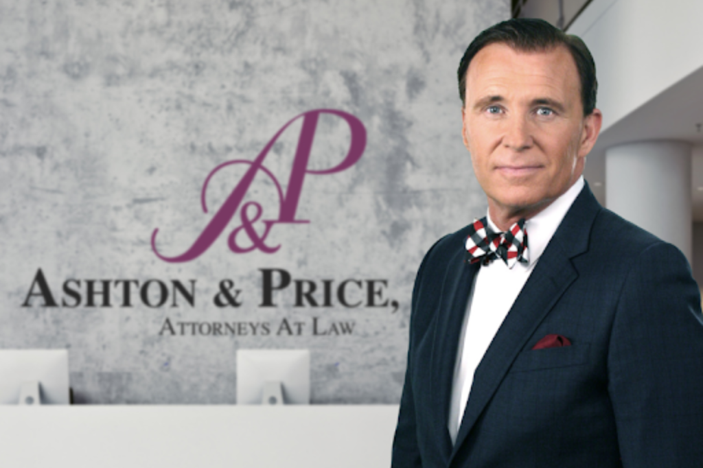 A man in a suit and bow tie stands in front of a wall with the "Ashton & Price, Attorneys At Law" logo.