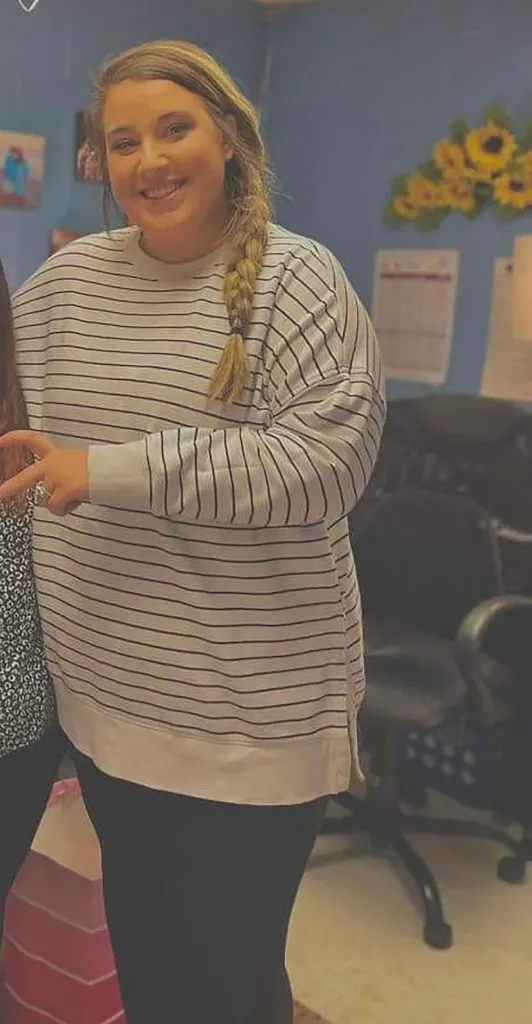 Jessica Finley in a striped shirt while working as a counselor.