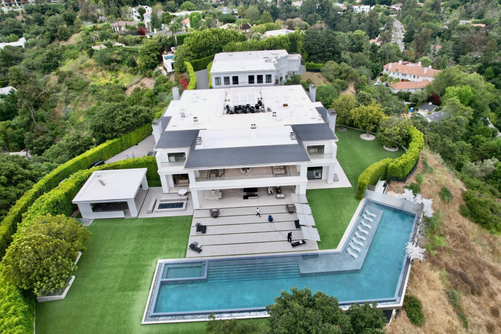 Aerial view of a $60 million Beverly Hills mansion with a large swimming pool.