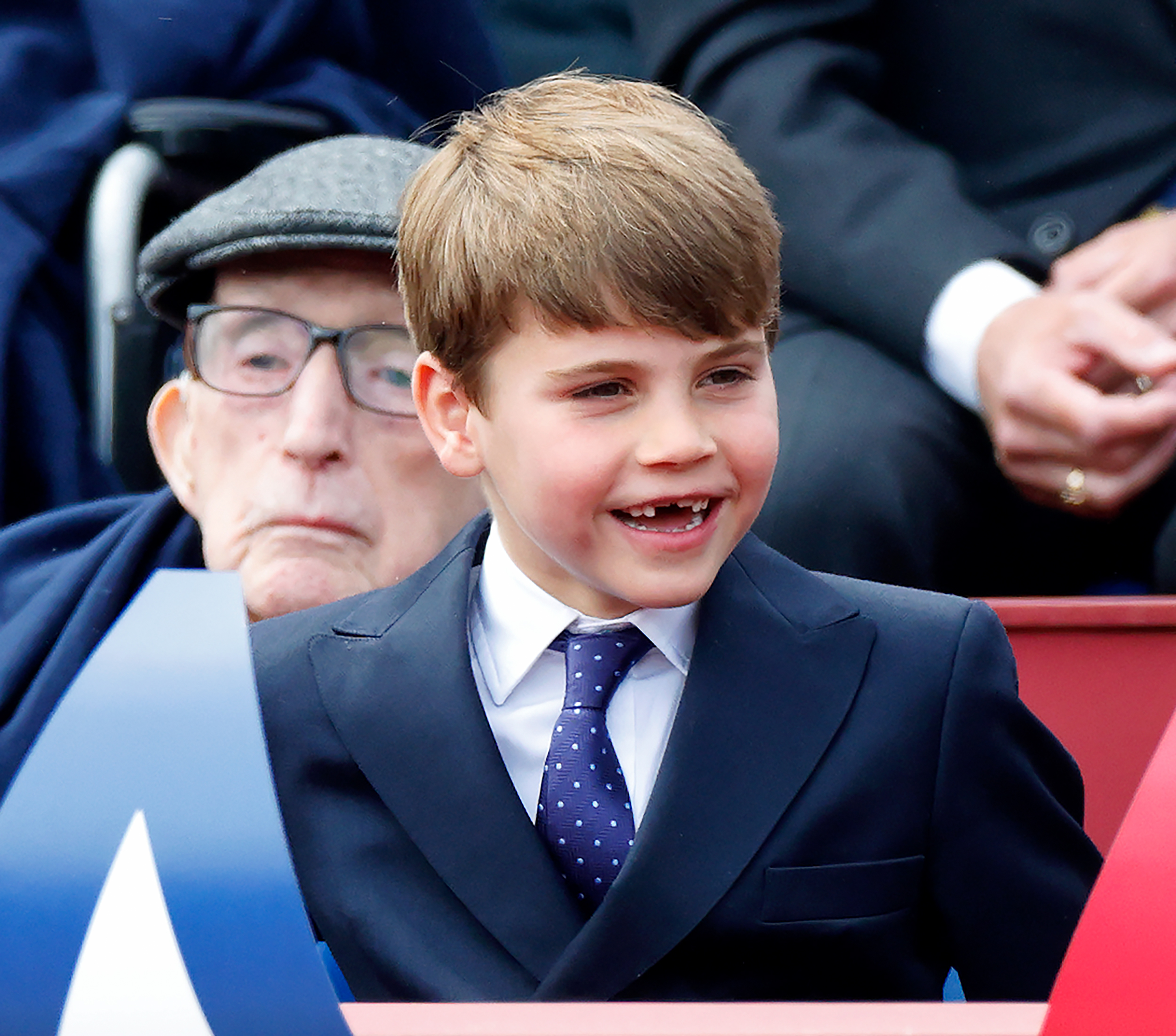 Prince Louis of Wales laughing during a military procession.