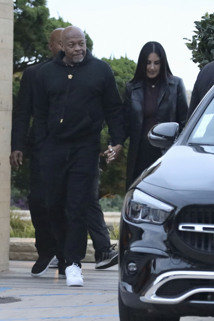 Dr. Dre and Michelle Saniei leaving Nobu restaurant hand-in-hand.