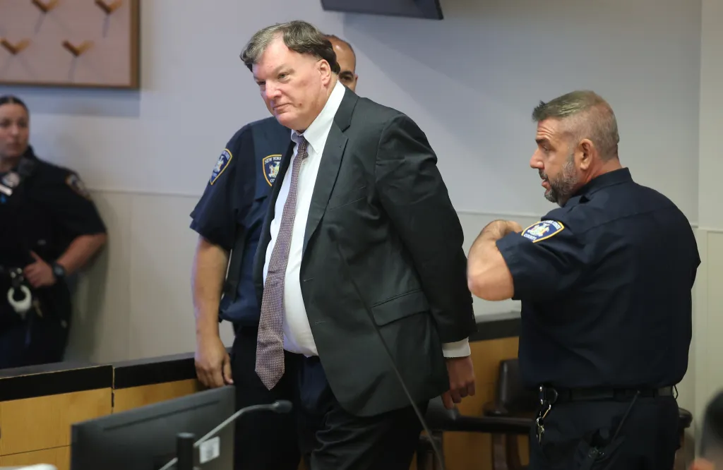 Alleged serial killer Rex A. Heuermann is escorted into Judge Tim Mazzei's courtroom at Suffolk County Court in Riverhead for a frye hearing on July 17, 2025 in Riverhead, New York. 