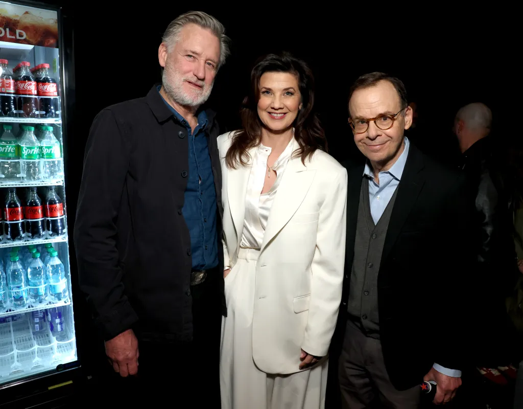 Bill Pullman, Daphne Zuniga, and Rick Moranis posing together at CinemaCon.