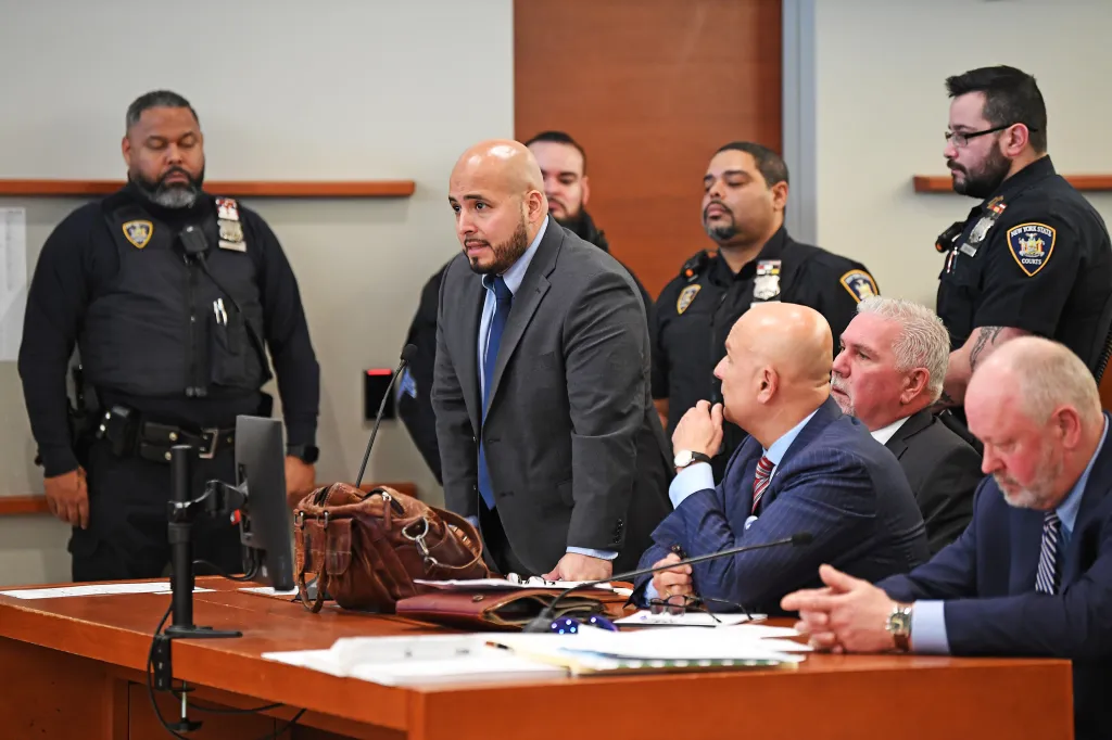 Video shot from court presentation showing a scooter and a person on the ground.