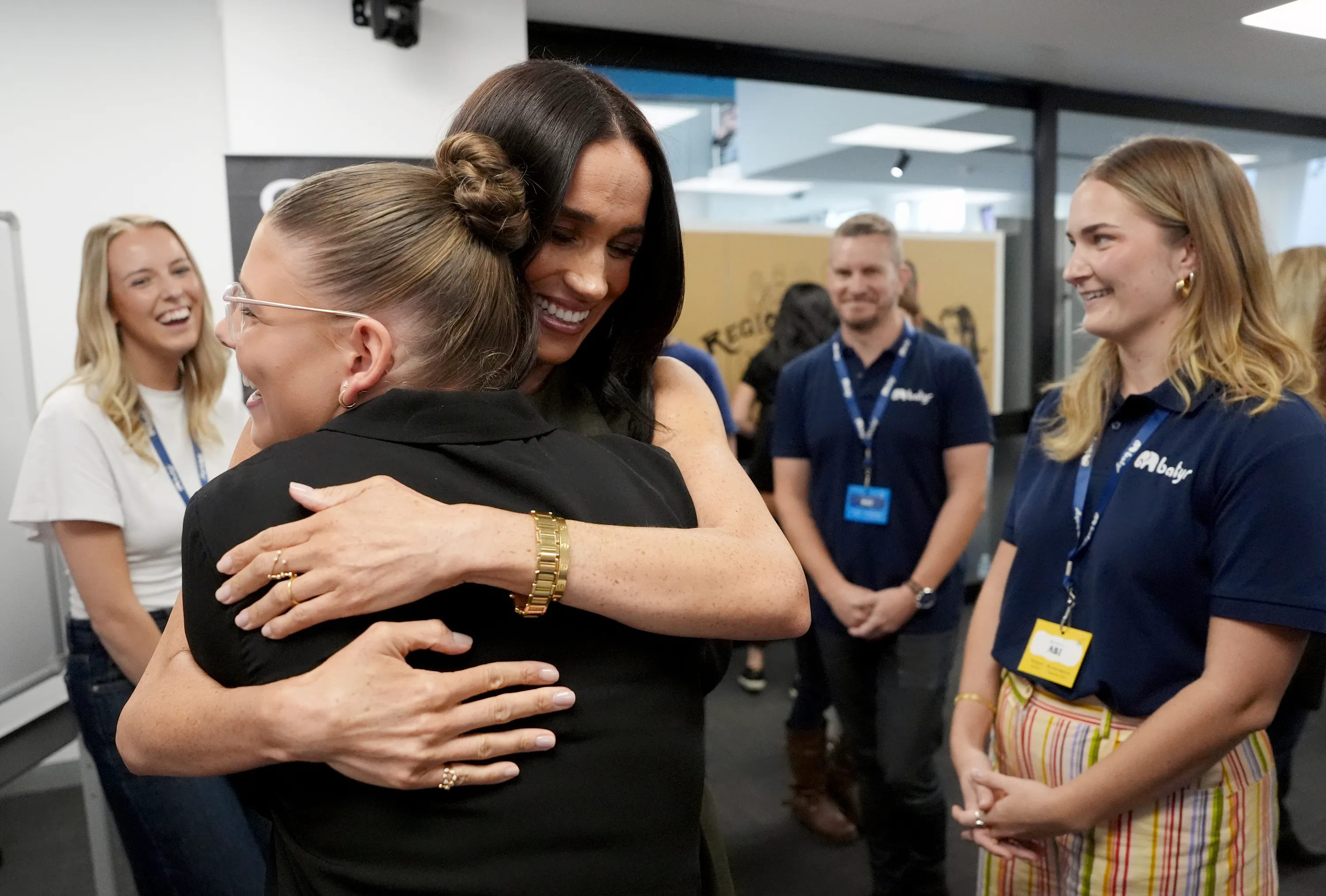 Meghan Markle hugging someone at Swinburne University of Technology in Melbourne, Australia