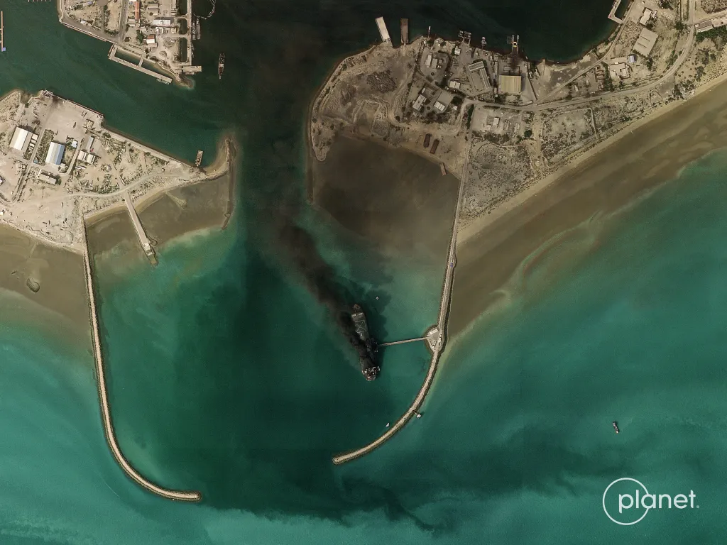 Satellite image showing smoke billowing from a vessel in the port of Bandar Abbas, Iran.