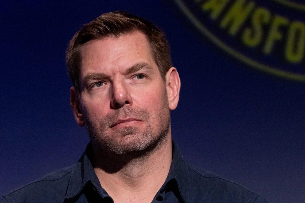 US Representative Eric Swalwell looking on during a forum.