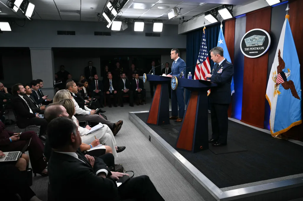 US Secretary of Defense Pete Hegseth speaks alongside Chairman of the Joint Chiefs of Staff General Dan Caine at a press briefing at the Pentagon.