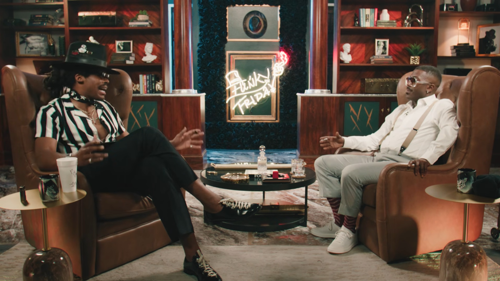 Ray J speaking with an interviewer on the show "Funky Friday."