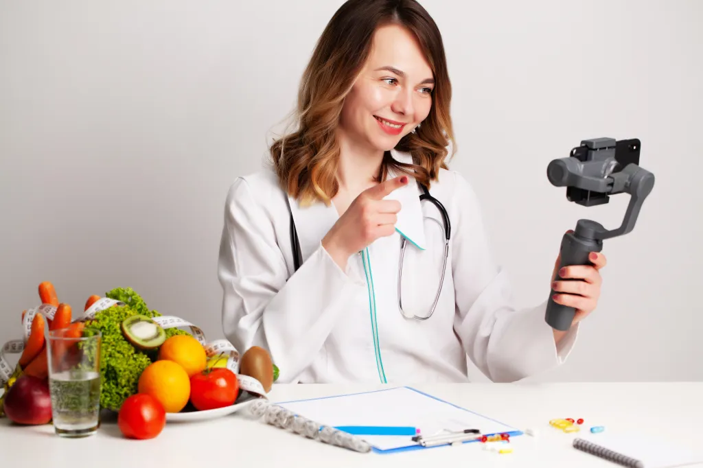 A young female dietitian creates content for a blog on weight loss and healthy eating.