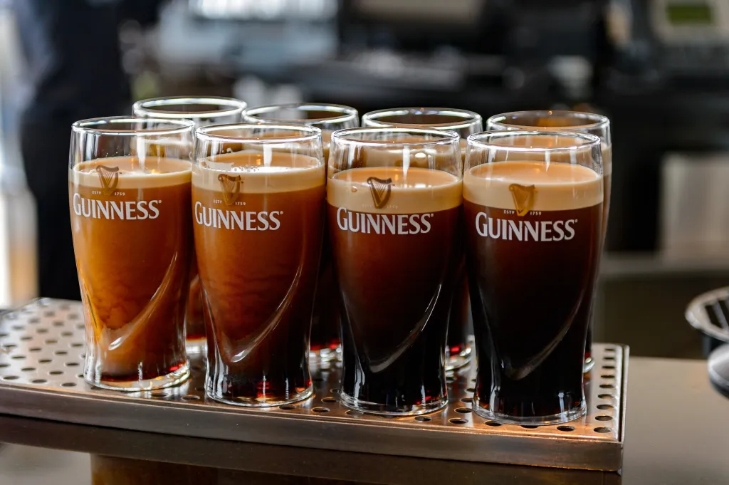 Pints of Guinness Irish dry stout in a museum.