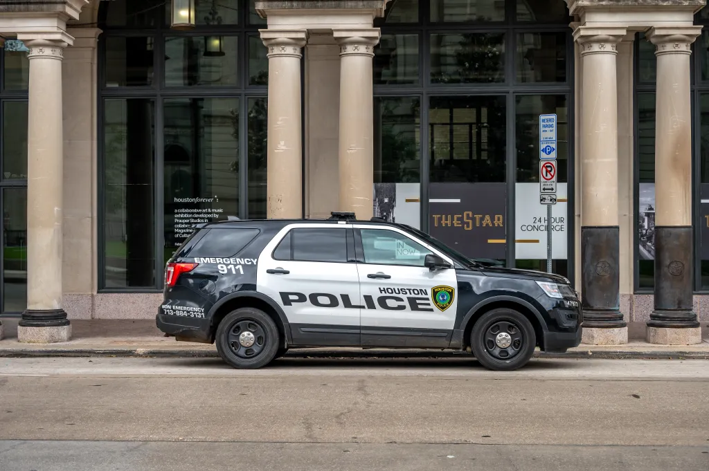 Houston Police car parked on a downtown street.