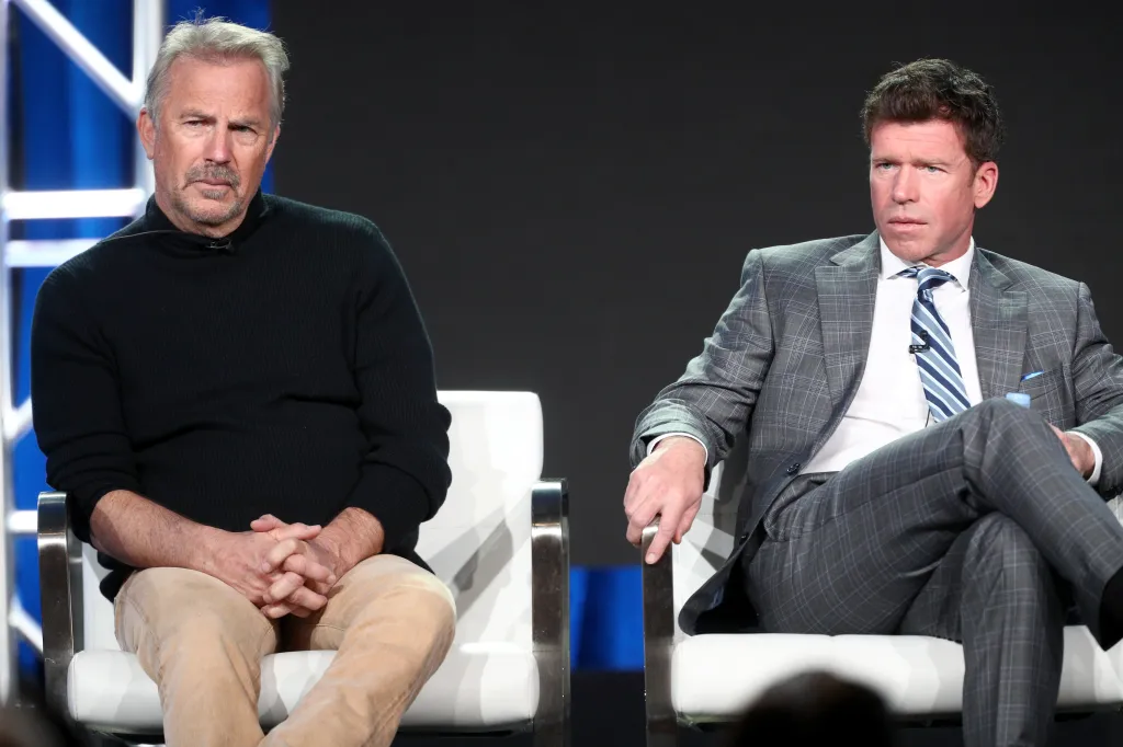 Actor Kevin Costner and producer/writer Taylor Sheridan sitting on stage.