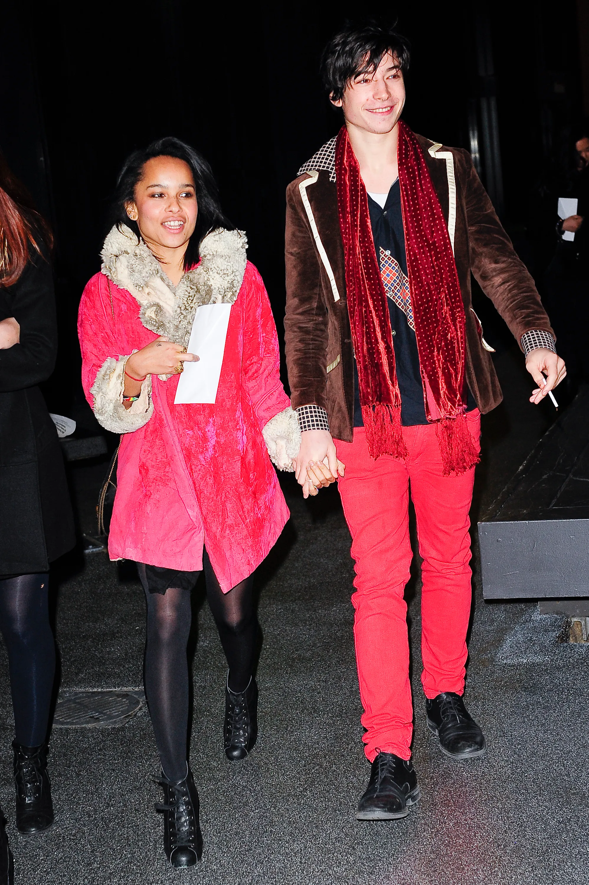 Actors Zoë Kravitz and Ezra Miller holding hands while leaving the Ziegfeld Theater.