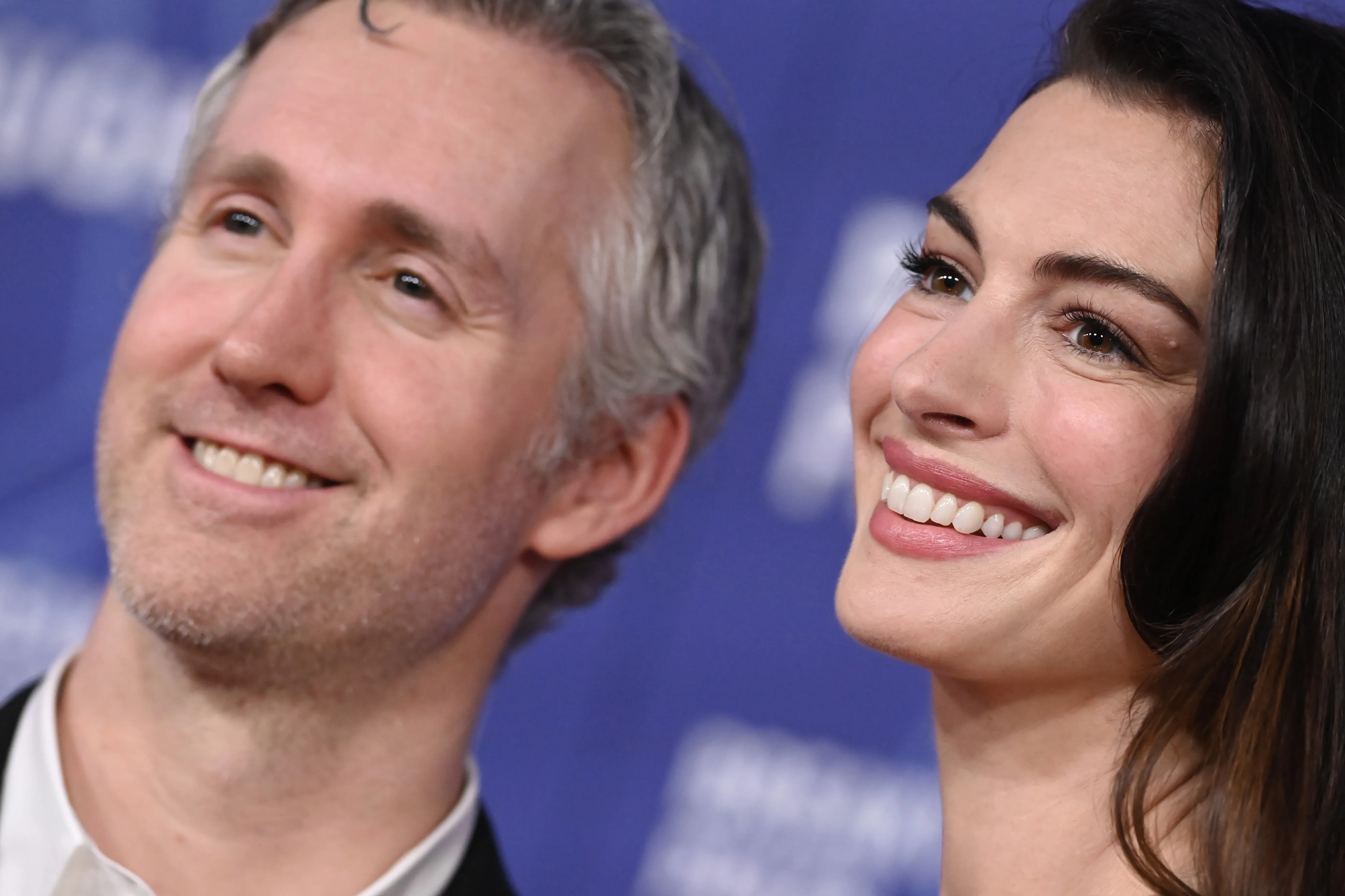 Adam Shulman and Anne Hathaway smile while attending the 12th Breakthrough Prize Ceremony.