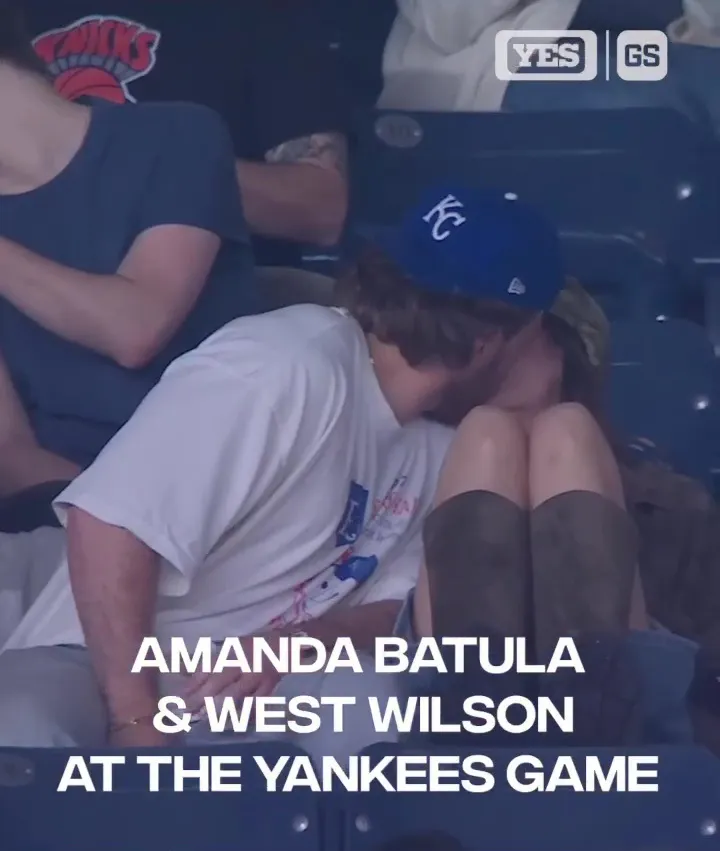 Amanda Batula and West Wilson kissing at a Yankees game.