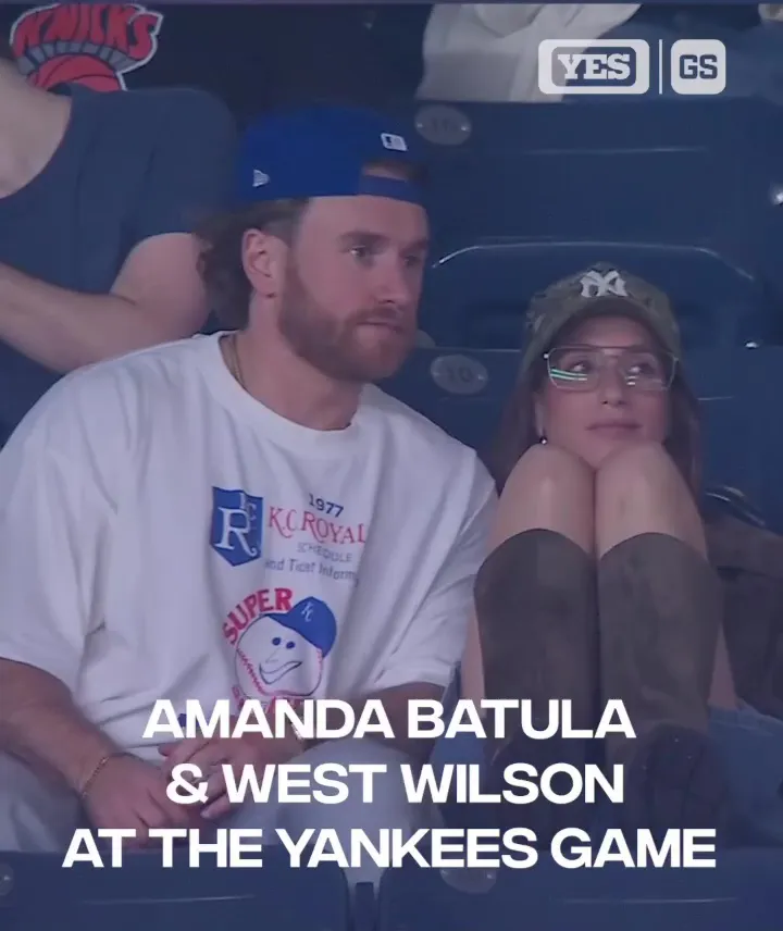 Amanda Batula and West Wilson kissing at a Yankees game.