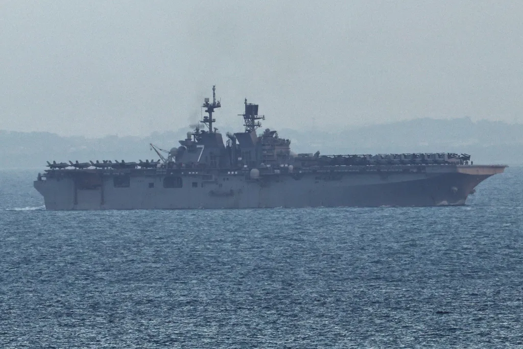 USS Tripoli (LHA-7) amphibious assault ship entering the Singapore Straits.