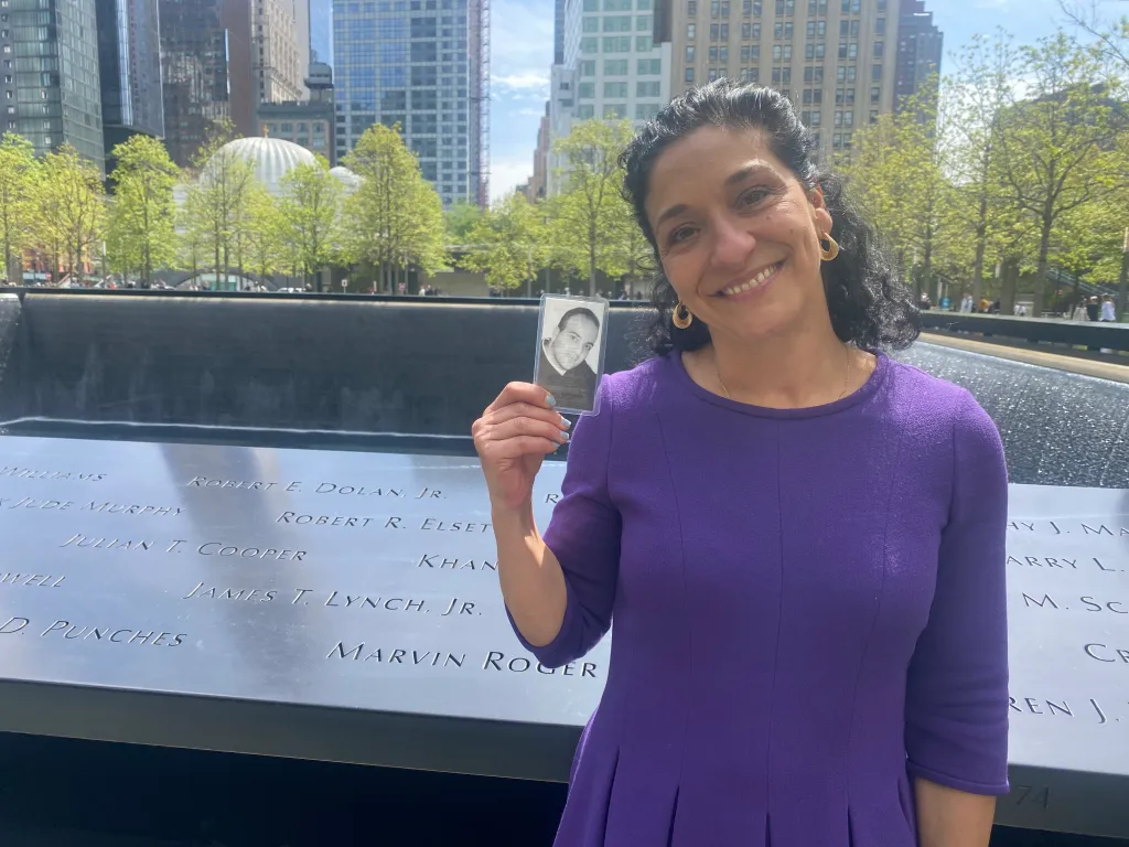 Anthoula Katsimatides holding a picture of her brother, John 