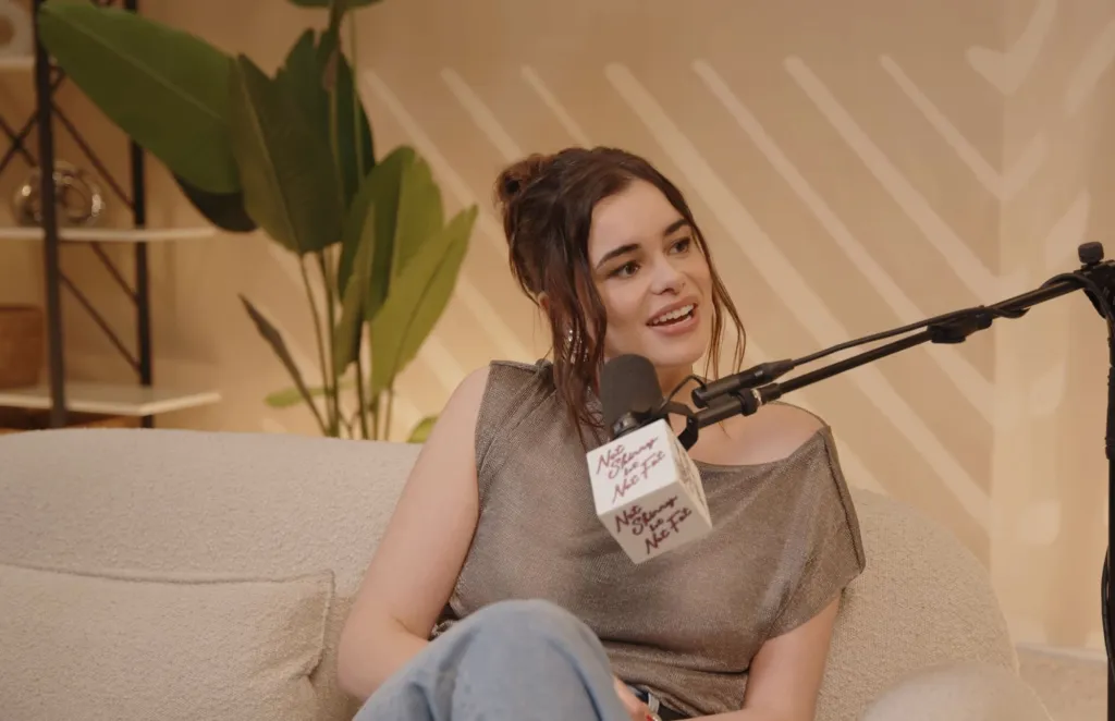 Barbie Ferreira speaking into a microphone.