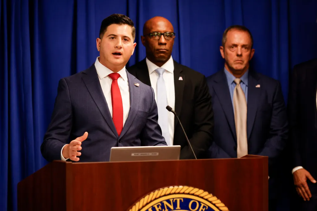 Bill Essayli, First Assistant U.S. Attorney, speaks at a press conference on fraud in California.
